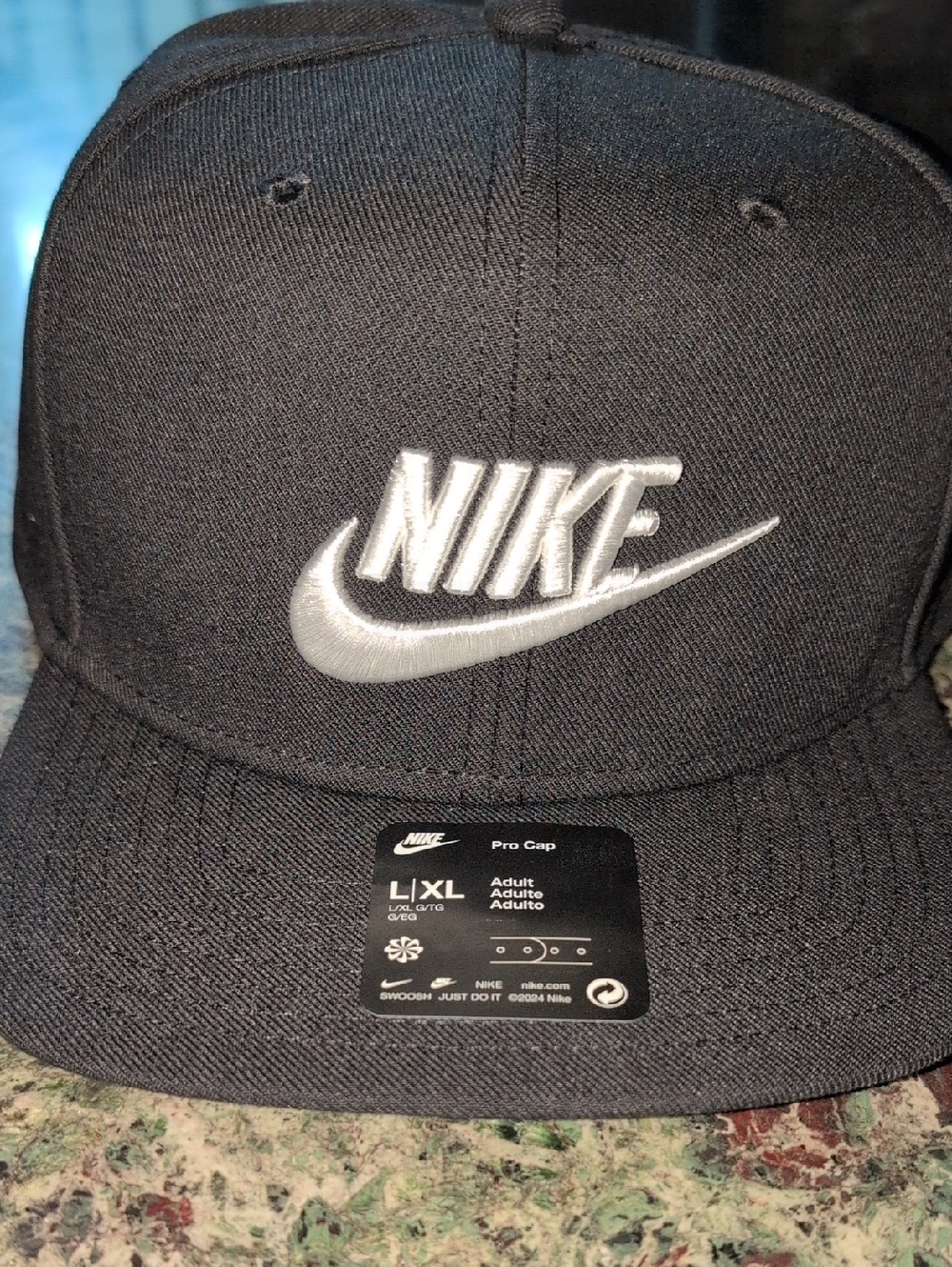 Nike Black Snapback Hat with Silver Swoosh and Logo